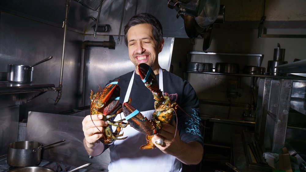 justin bazdarich chef holding lobsters