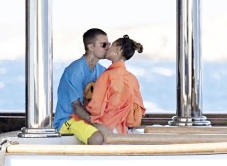 *EXCLUSIVE* Milos, GREECE  - Out in the Greek sunshine, the Canadian Superstar Justin Bieber and his wife, The American Model Hailey Bieber put on a rather amorous display spotted on their romantic getaway on the Greek island of Milos. 

The couple were spotted out on their boat and setting the temperatures soaring by packing on the PDA with a passionate kiss out in the Greek sunshine.

Justin wore a 'Drew' printed blue top with Hailey wearing a sexy striped orange bikini and blue shirt top.

**SHOT ON 06/28/2021**

Pictured: Justin Bieber, Hailey Bieber, Hailey Baldwin Bieber

BACKGRID USA 3 JULY 2021 

USA: +1 310 798 9111 / usasales@backgrid.com

UK: +44 208 344 2007 / uksales@backgrid.com

*UK Clients - Pictures Containing Children
Please Pixelate Face Prior To Publication*