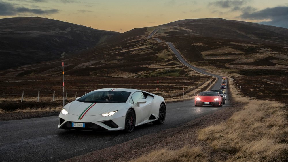 A convoy of Lamborghinis during a road trip through the Scottish Highlands.