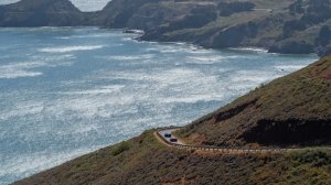 Supercars drive along a breathtaking section of road in Northern California as part of Robb Report's California Coastal Rally.