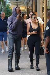 *PREMIUM-EXCLUSIVE* Miami, FL - Kanye West is treating his new GF Chaney James to some food and shopping at Miami's Bal Harbour. We caught Kanye taking a phone call while walking alongside his new beau. The rapper wore a Boston Fire Dept. hoodie and spent most of his time shopping at Balenciaga where he was seen buying up goods from his favorite designer for Jones. Kanye had similarly showered recent ex Julia Fox with pricey designer gifts as well.Pictured: Kanye West, Chaney JonesBACKGRID USA 24 FEBRUARY 2022 USA: +1 310 798 9111 / usasales@backgrid.comUK: +44 208 344 2007 / uksales@backgrid.com*UK Clients - Pictures Containing ChildrenPlease Pixelate Face Prior To Publication*
