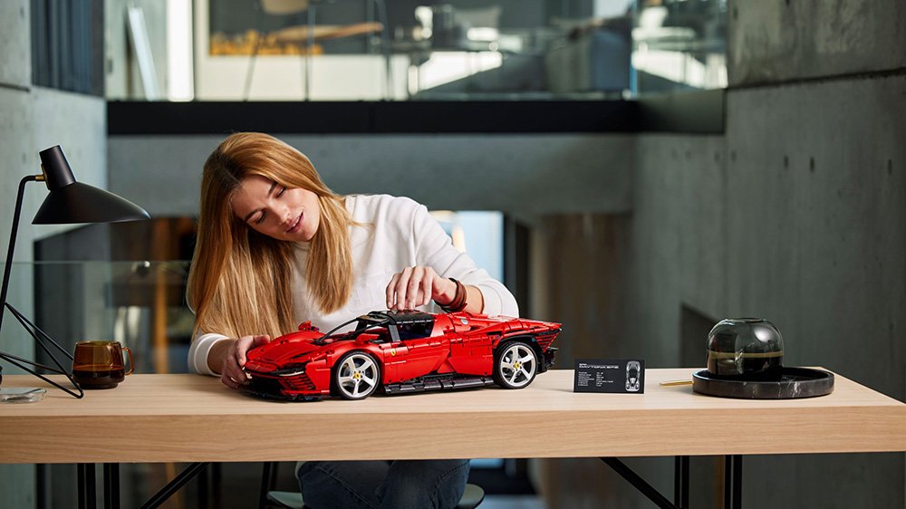 A woman works on the Lego Technic Ferrari Daytona SP3